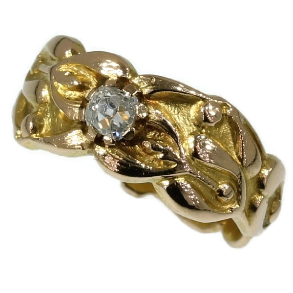 Antique Art Nouveau ring with mistletoe motif and high domed cushion cut diamond